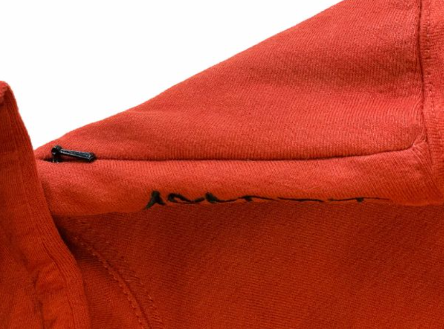 Asferi's burnt orange hoodie